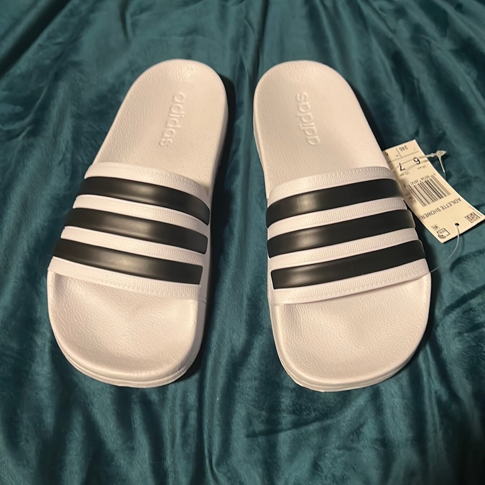 White brand new adidas adilette shower slides